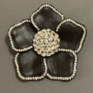 Black metal and rhinestone floral brooch